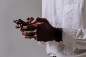 a businessman using an iPhone